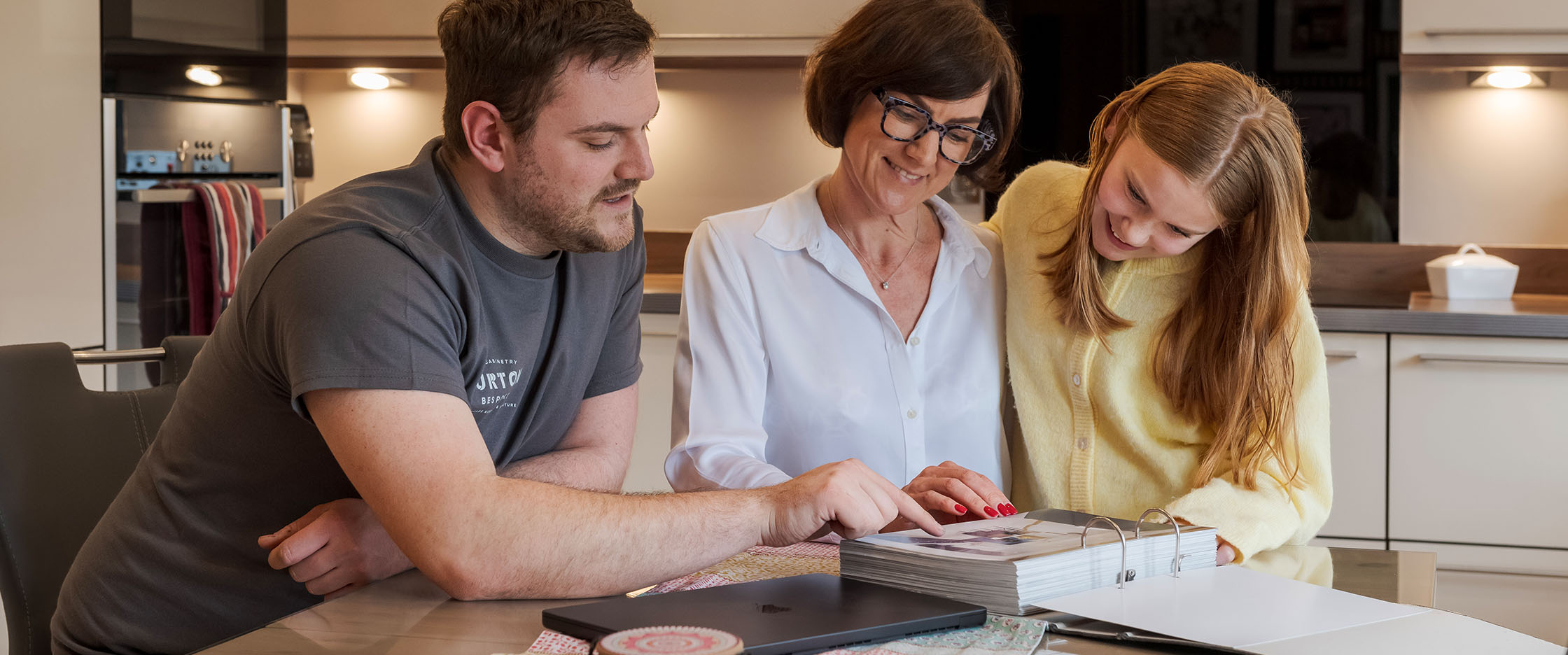 A joiner with a client discussing a new kitchen