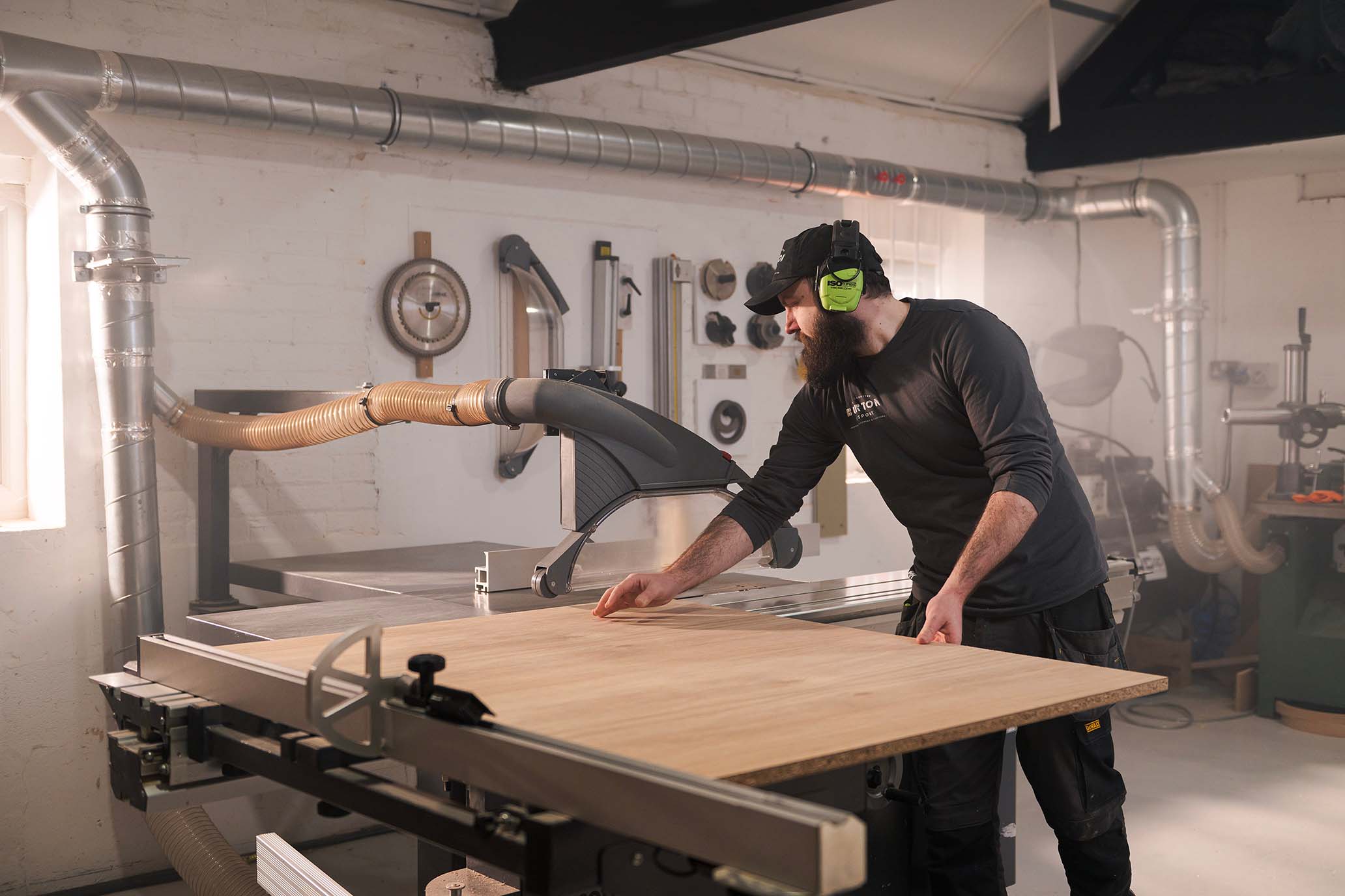 Person on saw in workshop {{brizy_dc_image_alt imageSrc=